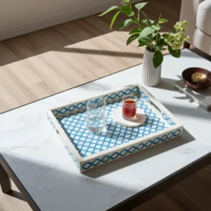 Blue diamond pattern bone inlay tray used for serving drinks near a window light