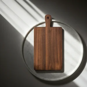 Handcrafted walnut cutting board featuring natural dark brown wood grain
