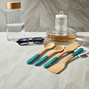 Handcrafted wooden kitchen utensil set featuring enamel finish handles