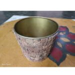 metal bucket with wooden bark inlaid