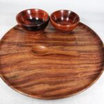 wooden plates with small bowls