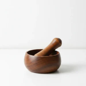acacia wood mortar and pestle set used for garlic crushing and herb grinding
