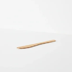 handmade wooden butter knife used as a jam and cheese spreader