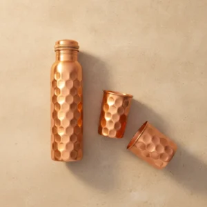 diamond hammered copper water bottle set with large rounded hammered pattern and polished finish
